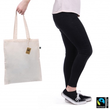 model carrying Fairtrade cotton & organic cotton tote bag