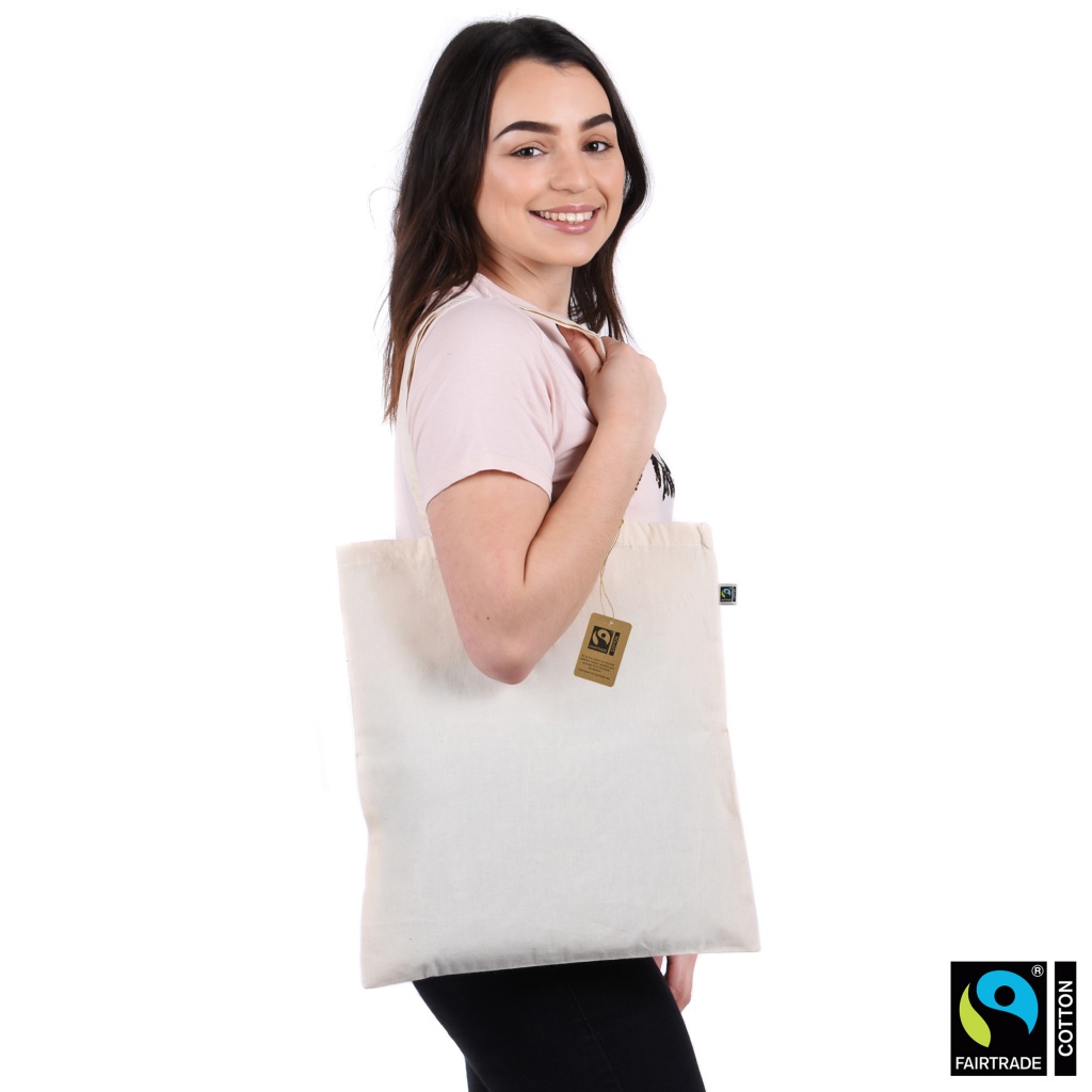 model wearing fairtrade and organic cotton bag